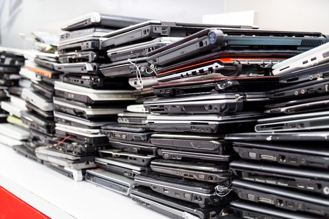 Stack of old, broken and obsolete laptop computer for repair